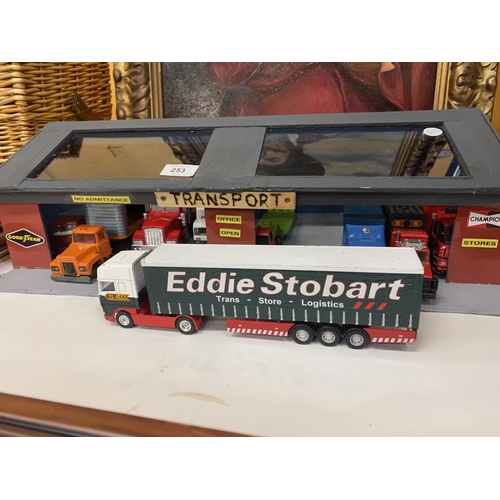 253 - A TRANSPORT GARAGE CONTAINING NINE TRUCKS AND LORRIES TO INCLUDE EDDIE STOBART, ETC