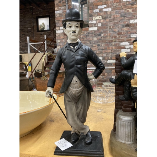 289 - A RESIN FIGURE OF CHARLIE CHAPLIN PLUS A FIGURE GROUP OF LAUREL AND HARDY HEIGHT 43CM