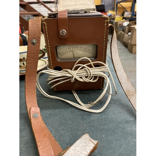 332 - A VINTAGE MEGGER SERIES THREE INSULATION TESTER WITH BAAKELITE SURROUND IN A LEATHER CASE