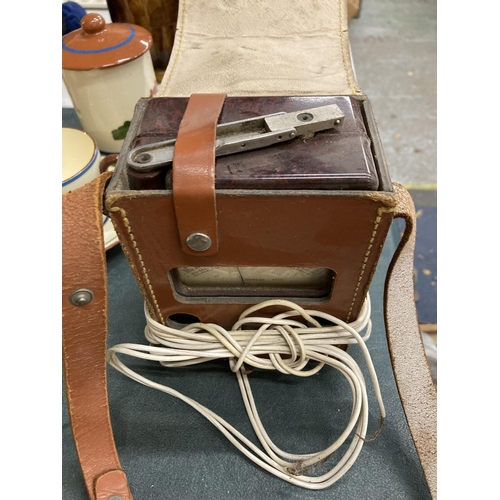 332 - A VINTAGE MEGGER SERIES THREE INSULATION TESTER WITH BAAKELITE SURROUND IN A LEATHER CASE