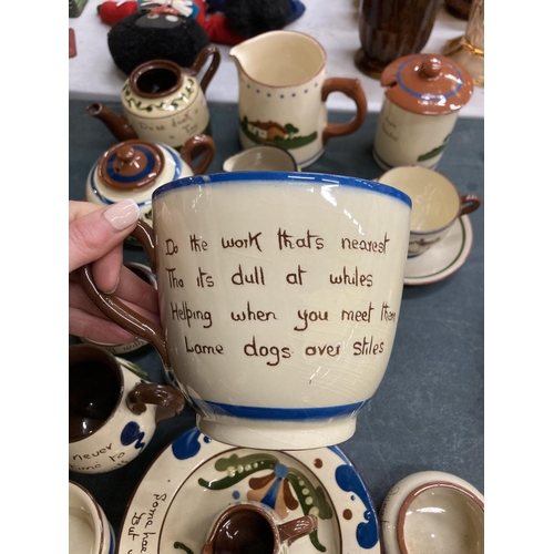 333 - A LARGE COLLECTION OF TORQUAY MOTTO WARE TO INCLUDE A TEAPOT, BOWLS, JUGS, CUPS, CANDLESTICKS, ETC