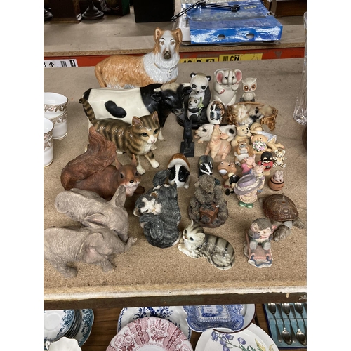 947 - A LARGE QUANTITY OF COLLECTABLES MAINLY ANIMALS TO INCLUDE ELEPHANTS, PIGS, CATS, DOGS ETC