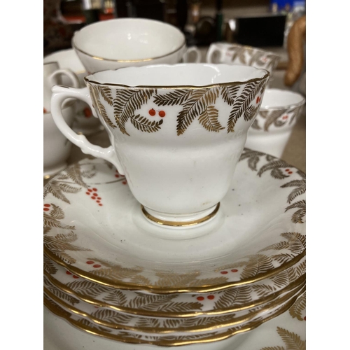 948 - A DAKIN BONE CHINA PART TEASET TOGETHER WITH CROWN TRENT STAFFORDSHIRE ENGLAND CUPS AND SAUCERS