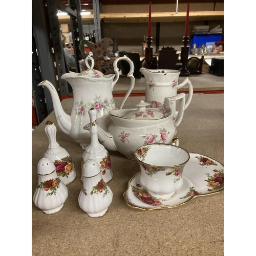 949 - A ROYAL ALBERT COLEEN COFFEEPOT TOGETHER WITH A FURTHER BOATSHAPED CABBAGE ROSE TEAPOT AND HOT WATER... 