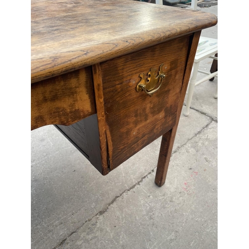 2672 - A MID 20TH CENTURY OAK TWIN-PEDESTAL OFFICE DESK