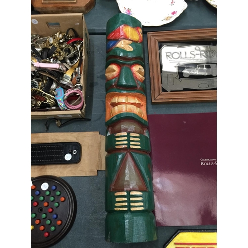 148 - A WOODEN 'TIKI' STATUE HEIGHT 61CM