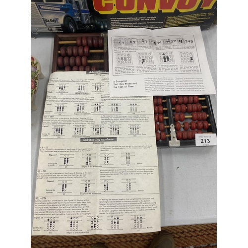 213 - TWO JAPANESE ABACUS WITH INSTRUCTIONS AND A BOOKLET