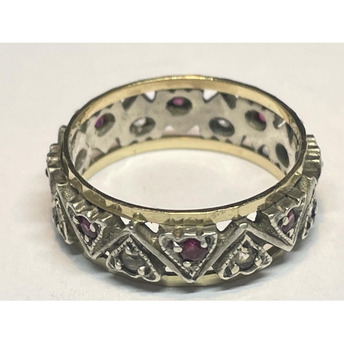 617 - A 9 CARAT GOLD AND SILVER RING WITH RED AND CLEAR  STONES IN A HEART DESIGNS  SIZE M IN A PRESENTATI... 