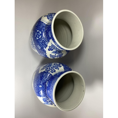 316 - A PAIR OF JAPANESE MEIJI PERIOD (1868-1912) BLUE AND WHITE POTTERY VASES WITH FLORAL FAN DESIGN ON A... 