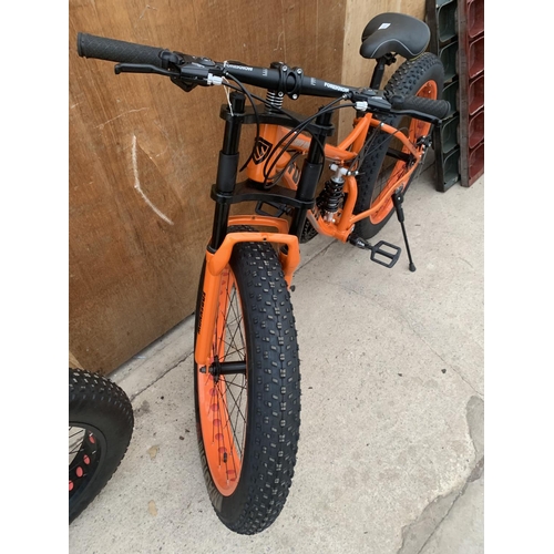 1204 - AN AS NEW ORANGE FOREKNOW SNOW BIKE WITH FRONT AND REAR SUSPENSION AND 24 SPEED SHIMANO GEAR SYSTEM