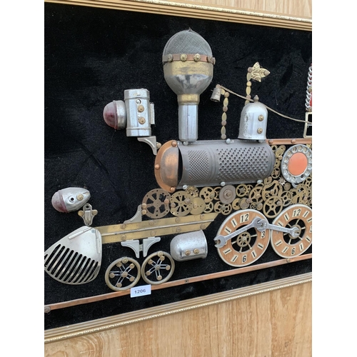 1206 - A GILT FRAMED SCRATCH BUILT IMAGE OF A TRAIN USING VARIOUS VINTAGE ITEMS