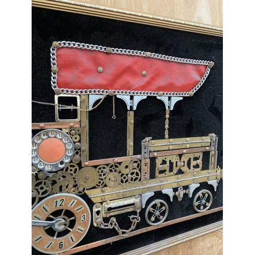 1206 - A GILT FRAMED SCRATCH BUILT IMAGE OF A TRAIN USING VARIOUS VINTAGE ITEMS