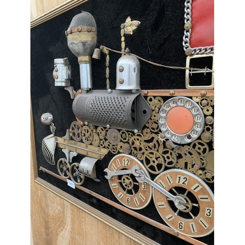 1206 - A GILT FRAMED SCRATCH BUILT IMAGE OF A TRAIN USING VARIOUS VINTAGE ITEMS