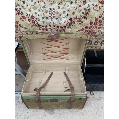 1211 - A VINTAGE DOME TOPPED TRAVEL TRUNK WITH LEATHER STRAPS AND CARRYING HANDLES