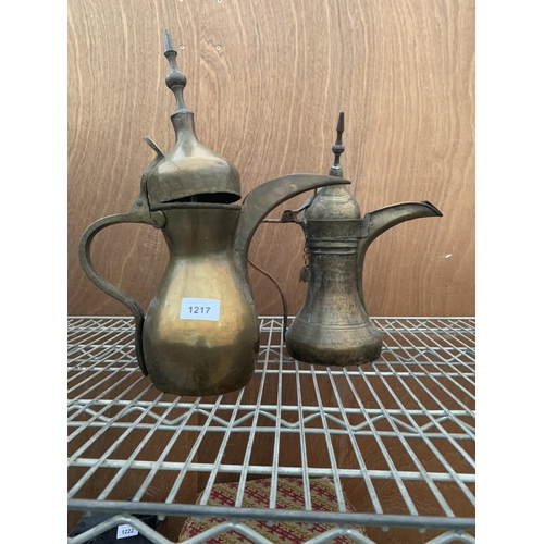 1217 - TWO VINTAGE BRASS MIDDLE EASTERN STYLE LIDDED JUGS