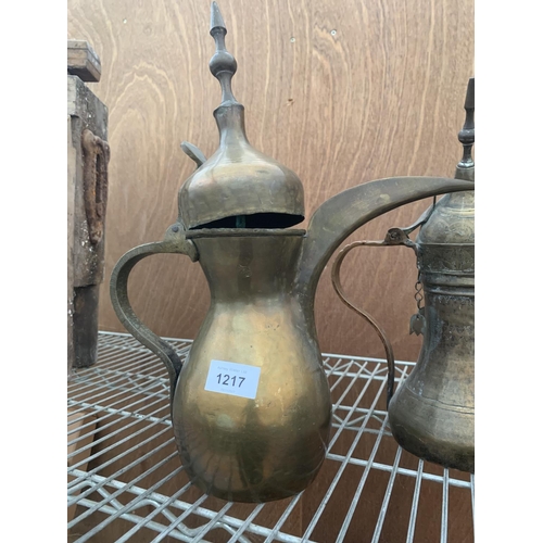 1217 - TWO VINTAGE BRASS MIDDLE EASTERN STYLE LIDDED JUGS