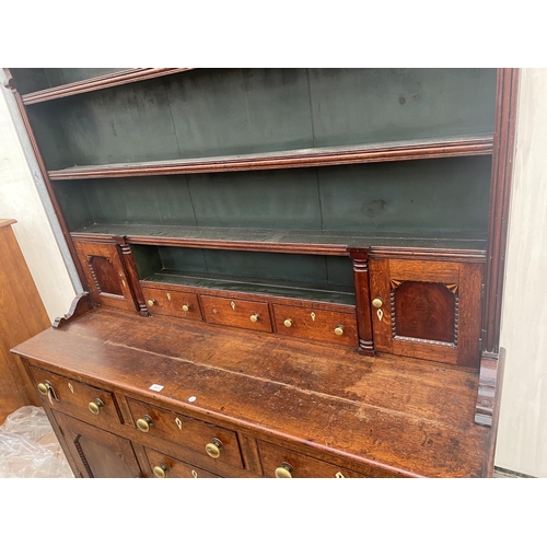 2205 - A GEORGE III OAK DRESSER, THE BASE ENCLOSING THREE LONG AND THREE SHORT DRAWERS AND TWO CUPBOARDS, T... 