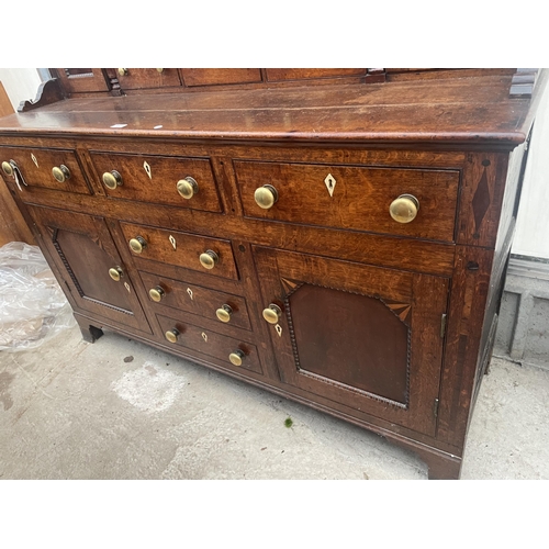 2205 - A GEORGE III OAK DRESSER, THE BASE ENCLOSING THREE LONG AND THREE SHORT DRAWERS AND TWO CUPBOARDS, T... 