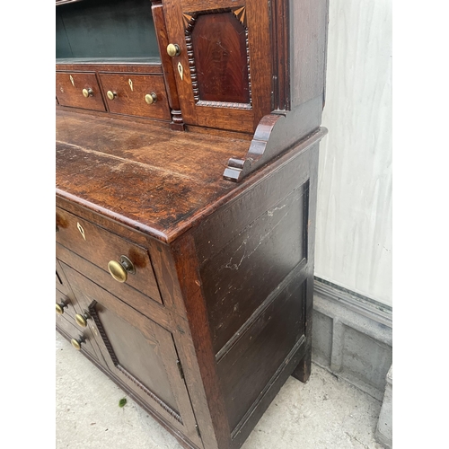 2205 - A GEORGE III OAK DRESSER, THE BASE ENCLOSING THREE LONG AND THREE SHORT DRAWERS AND TWO CUPBOARDS, T... 