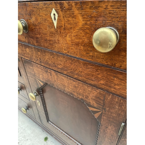 2205 - A GEORGE III OAK DRESSER, THE BASE ENCLOSING THREE LONG AND THREE SHORT DRAWERS AND TWO CUPBOARDS, T... 