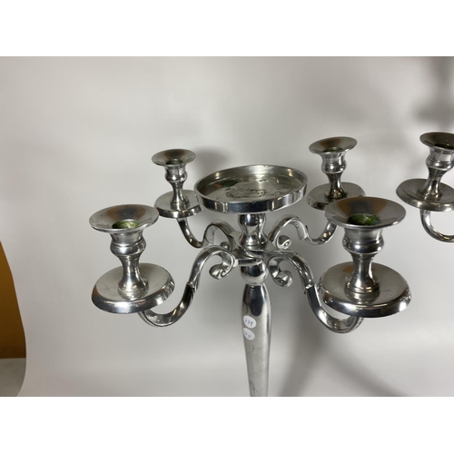 18 - A LARGE PAIR OF CHROME FOUR BRANCH CANDLESTICKS WITH CENTRAL CIRCULAR SECTION