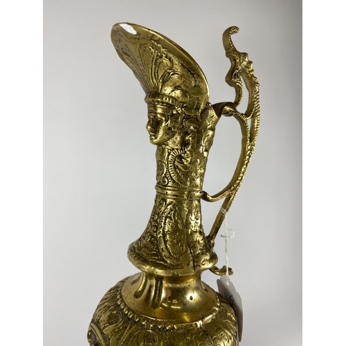 21 - A HEAVY GILT DESIGN CLARET JUG WITH FLORAL DESIGN BASE