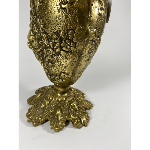 21 - A HEAVY GILT DESIGN CLARET JUG WITH FLORAL DESIGN BASE