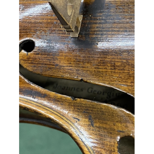 22 - A 19TH CENTURY CASED VIOLIN WITH PAPER LABEL TO INTERIOR - 'JOANNES GEORGIUS' (DATE DIFFICULT TO REA... 