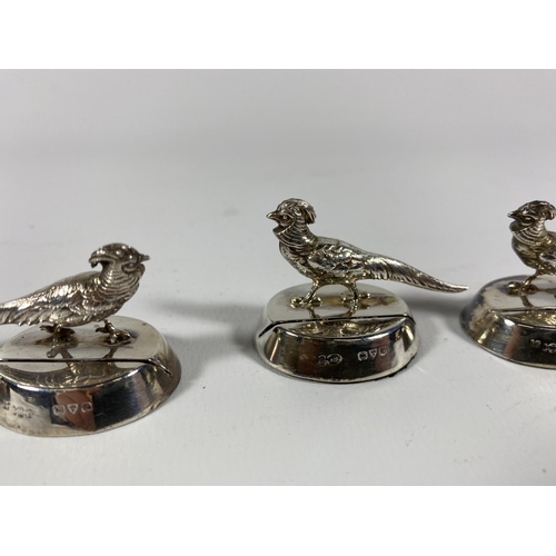 5A - A SET OF FOUR GEORGE V HALLMARKED SILVER PHEASANT PLACEHOLDERS, DATES TO CHESTER, 1913