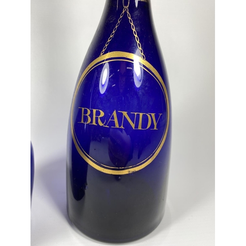 8 - TWO GEORGIAN BRISTOL BLUE GLASS DECANTERS - 'BRANDY' & 'HOLLANDS'