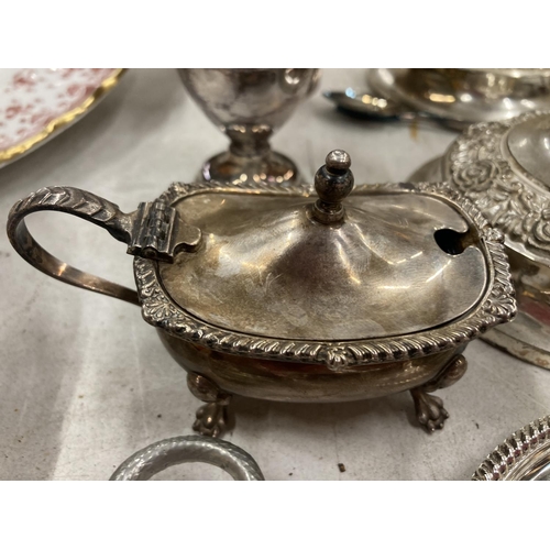 194 - A QUANTITY OF SILVER PLATED ITEMS TO INCLUDE A TOAST RACK, COASTERS, CANDLESTICKS, MUSTARD POT, BOWL... 