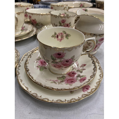 200 - A QUANTITY OF SALISBURY CHINA TEAWARE WITH A ROSE PATTERN TO INCLUDE CUPS, SAUCERS, SIDE PLATES, SER... 