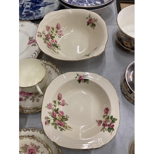 200 - A QUANTITY OF SALISBURY CHINA TEAWARE WITH A ROSE PATTERN TO INCLUDE CUPS, SAUCERS, SIDE PLATES, SER... 