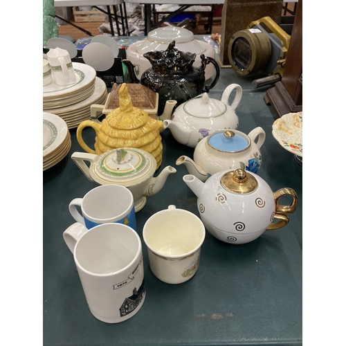 69 - A QUANTITY OF TEAPOTS TO INCLUDE BURLEIGHWARE, SADLER, POOLE, ETC PLUS MUGS