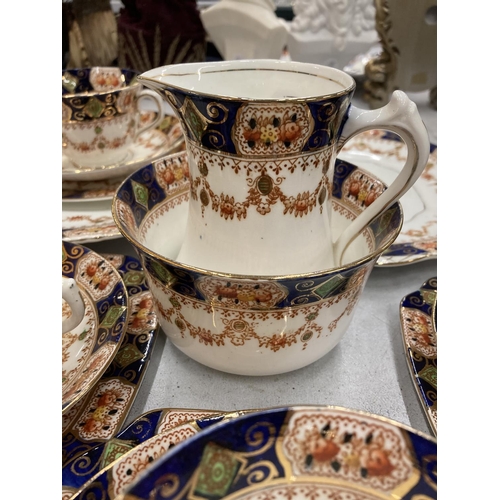 86 - A VINTAGE ST MICHAEL TEASET TO INCLUDE CAKE PLATES, SUGAR BOWL, CREAM JUG, CUPS, SAUCERS AND SIDE PL... 
