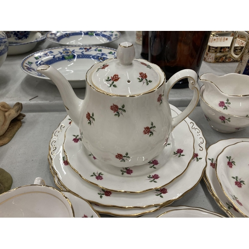 149 - A COLCLOUGH CHINA TEASET TO INCLUDE A TEAPOT, CREAM JUG, SUGAR BOWL, CAKE PLATE, CUPS, SAUCERS AND S... 