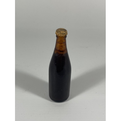 406 - A MINIATURE GUINNESS EXTRA STOUT BOTTLE