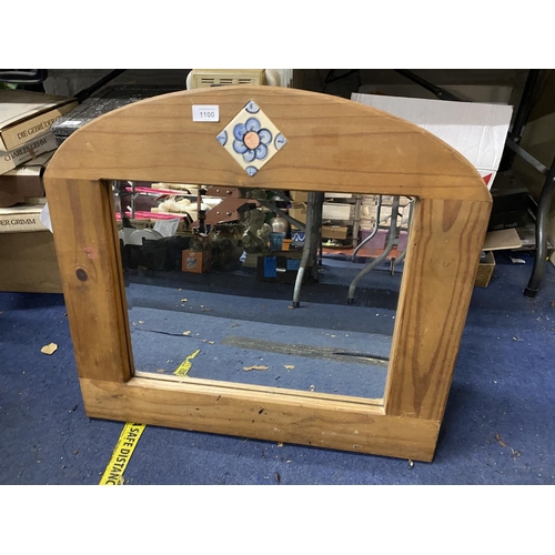 1100 - A WOODEN FRAMED MIRROR WITH FLORAL DESIGN