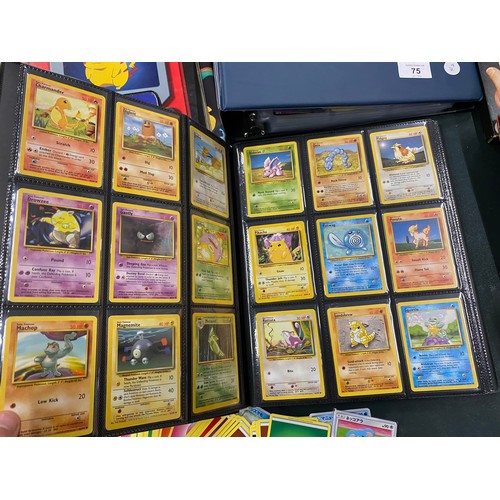 74 - A FOLDER OF POKEMON CARDS TO INCLUDE 1999 BASE SET, TOPPS SERIES 1 INCLUDING CHARIZARD AND HOLOS