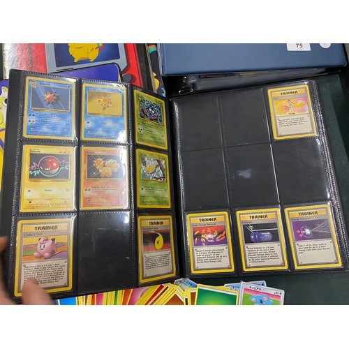 74 - A FOLDER OF POKEMON CARDS TO INCLUDE 1999 BASE SET, TOPPS SERIES 1 INCLUDING CHARIZARD AND HOLOS