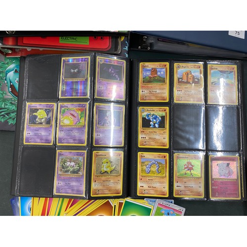 74 - A FOLDER OF POKEMON CARDS TO INCLUDE 1999 BASE SET, TOPPS SERIES 1 INCLUDING CHARIZARD AND HOLOS