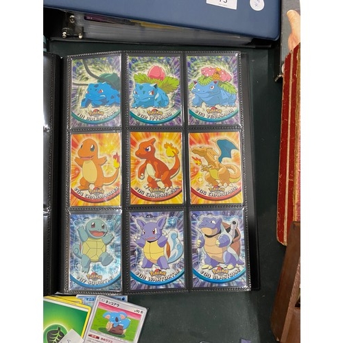 74 - A FOLDER OF POKEMON CARDS TO INCLUDE 1999 BASE SET, TOPPS SERIES 1 INCLUDING CHARIZARD AND HOLOS