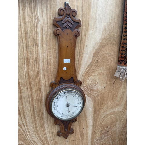 1215A - A VINTAGE WOODEN CASED WALL HANGING BAROMETER