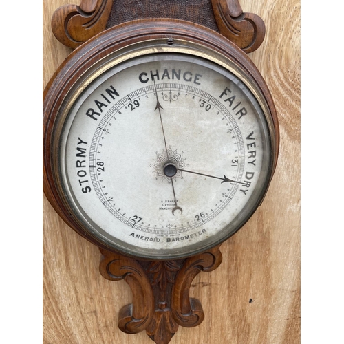 1215A - A VINTAGE WOODEN CASED WALL HANGING BAROMETER