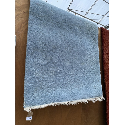 2194 - A MODERN BLUE FRINGED RUG