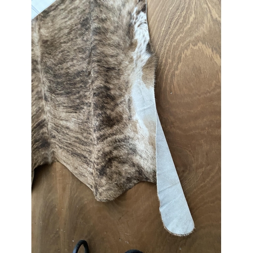 2196 - A LARGE ANIMAL HIDE RUG