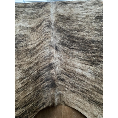 2196 - A LARGE ANIMAL HIDE RUG