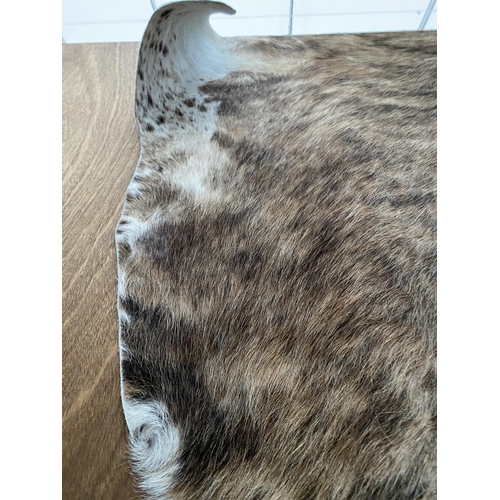 2196 - A LARGE ANIMAL HIDE RUG