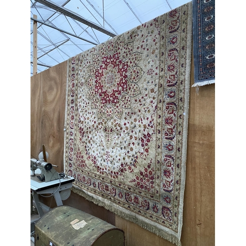 2198 - A LARGE CREAM PATTERNED FRINGED RUG BEARING THE LABEL MADE IN BELGIUM (200CM X 300CM)