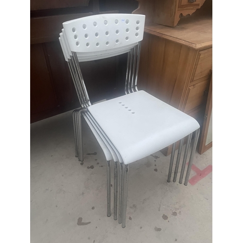 2668 - FOUR RETRO STYLE WHITE PLASTIC AND CHROME STACKING KITCHEN CHAIRS